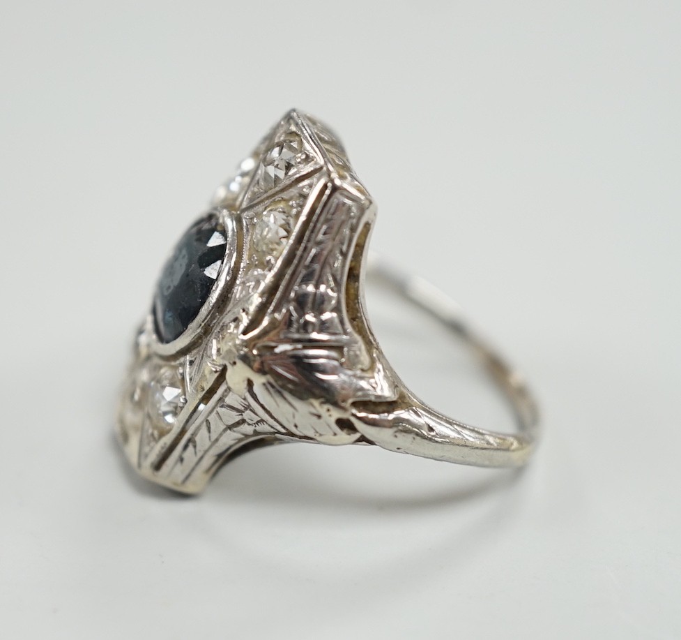 A 1940's? white metal, sapphire and diamond cluster set hexagonal dress ring, size L, gross weight 4.6 grams.